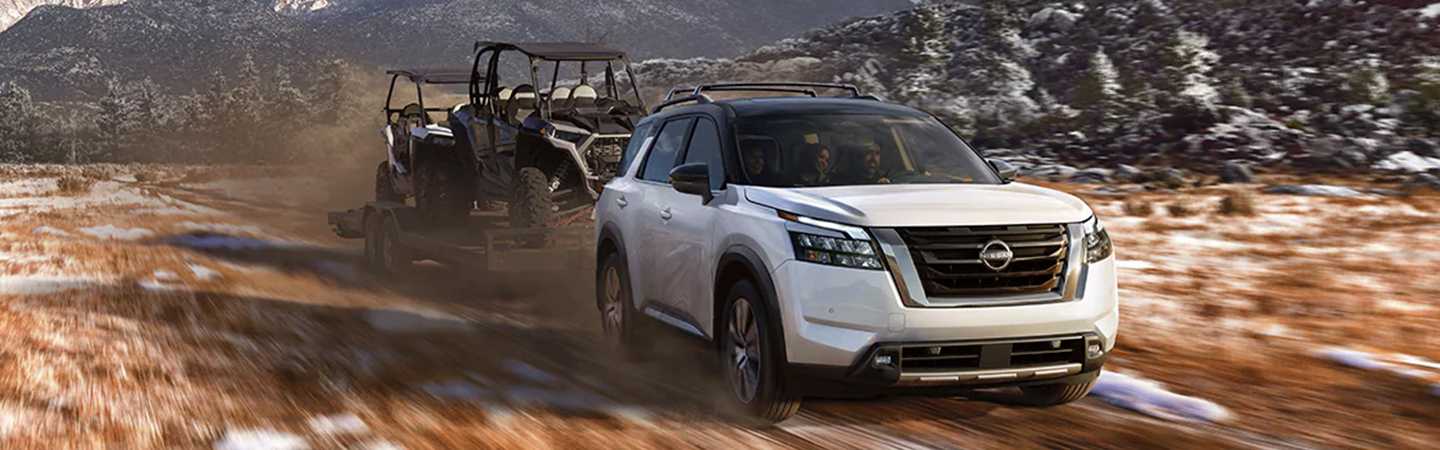 Nissan Frontier vs Nissan Pathfinder white color frontview