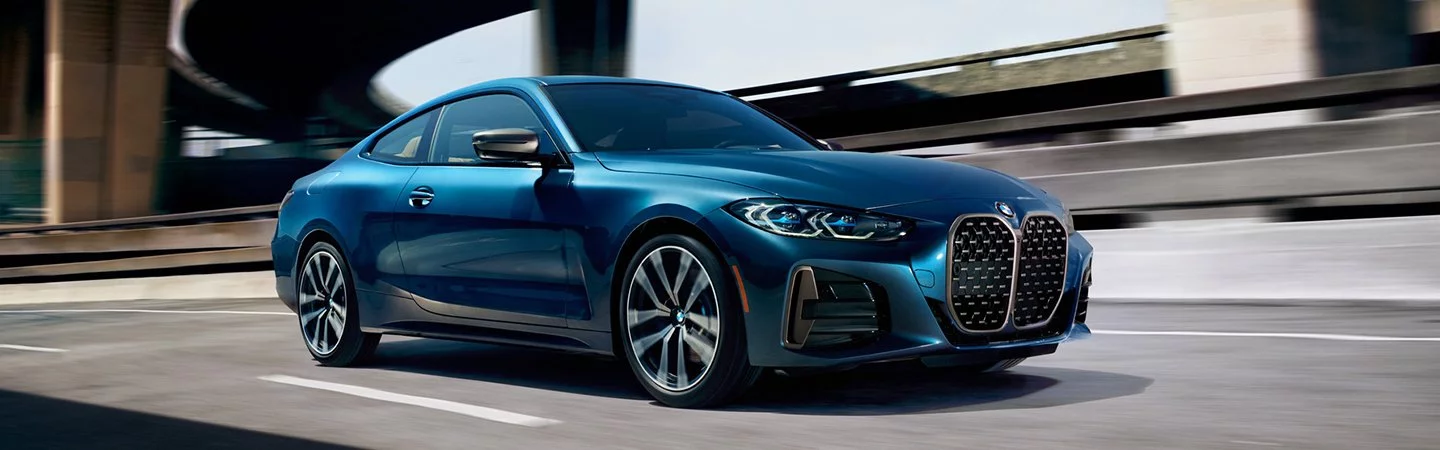 2025 BMW 4 Series Blue color car running on road