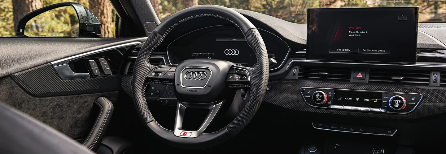 Interior view of the driver seat and tech of 2025 Audi A4