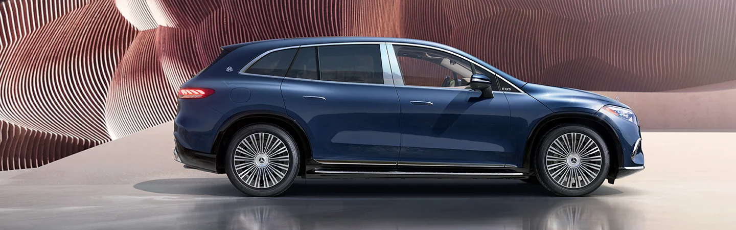 Side view of a parked  blue 2025 Mercedes-Benz EQS Maybach
