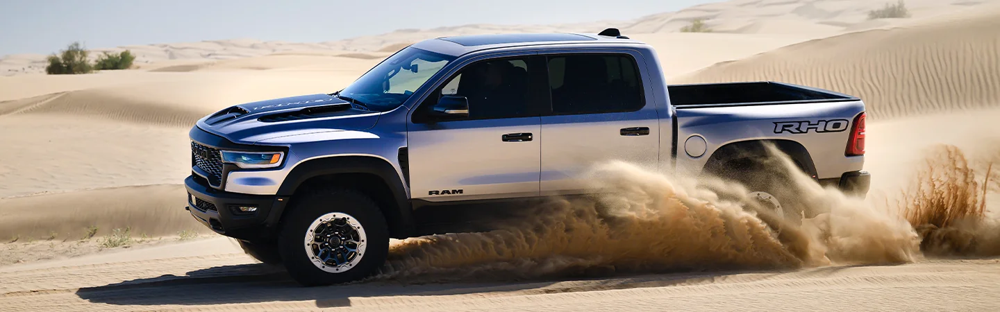 2025 Ford F-150 vs RAM 1500 silvercolor sideview