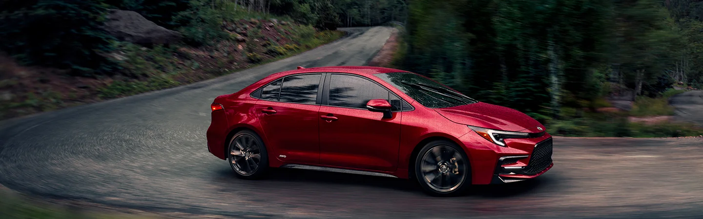a red 2026 Toyota Corolla on a curve