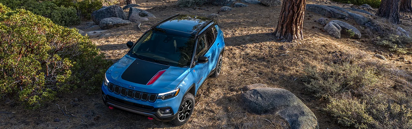 top view of a 2026 Jeep Compass Limited parked in the woods