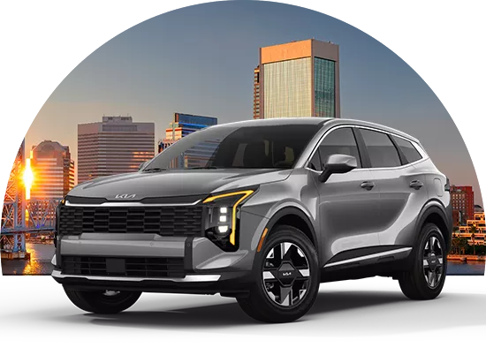 Brand new Kia parked in front of a city skyline in Jacksonville, FL