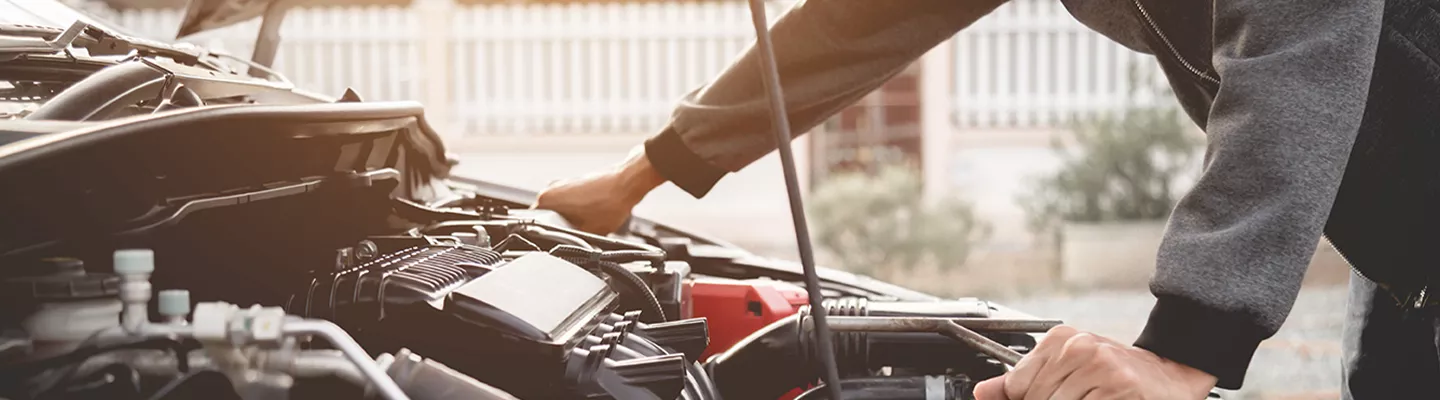 Service technician working on a Chevrolet vehicle
