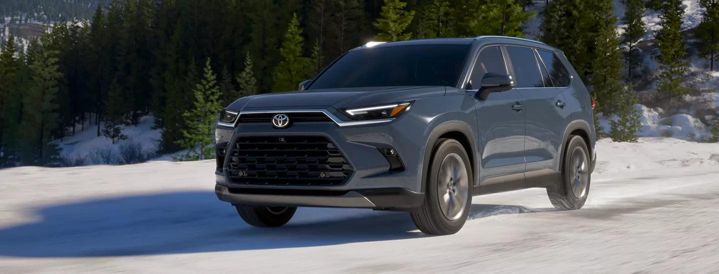 2026 Toyota Grand Highlander driving on a snowy road