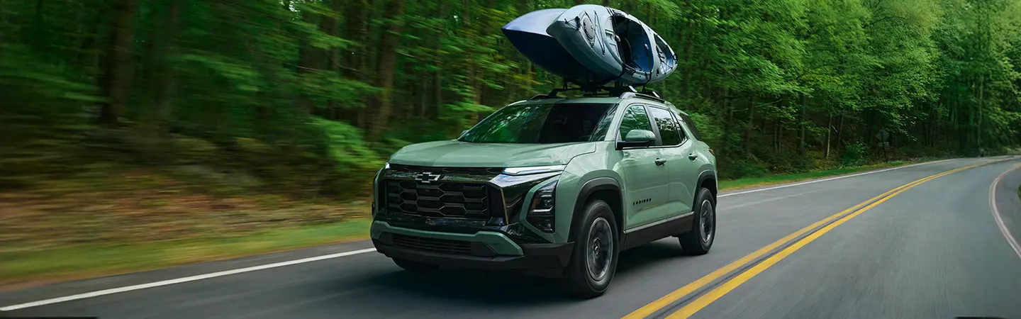 Red 2025 Chevrolet Trax parked at the beach