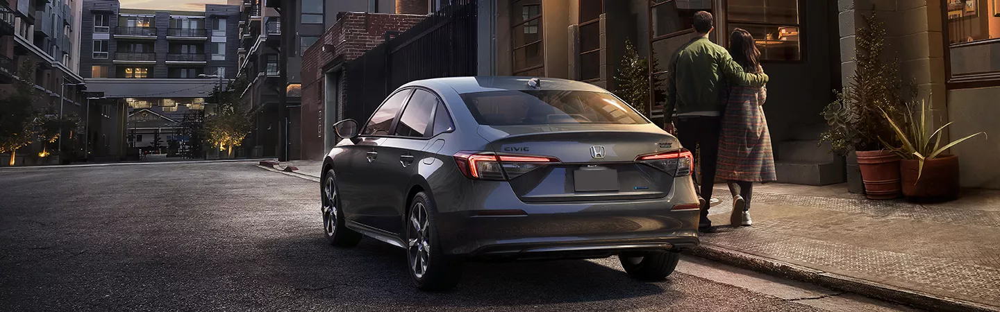 2026 Honda Civic parked on a city street at dusk