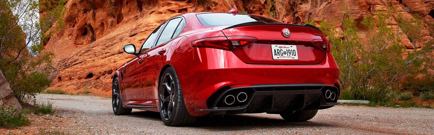 Close-up of the front wheel of a red 2021 Alfa Romeo Giulia Quadrifoglio.