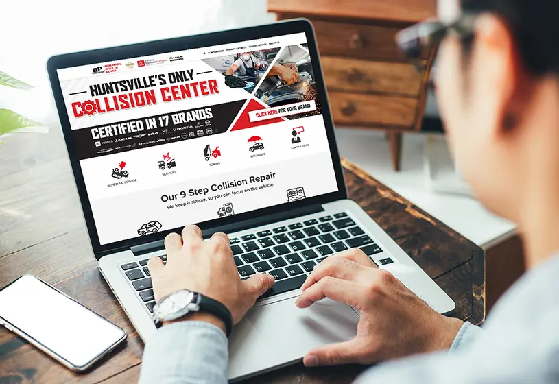 customer setting up collison service on his laptop at home near Huntsville Alabama