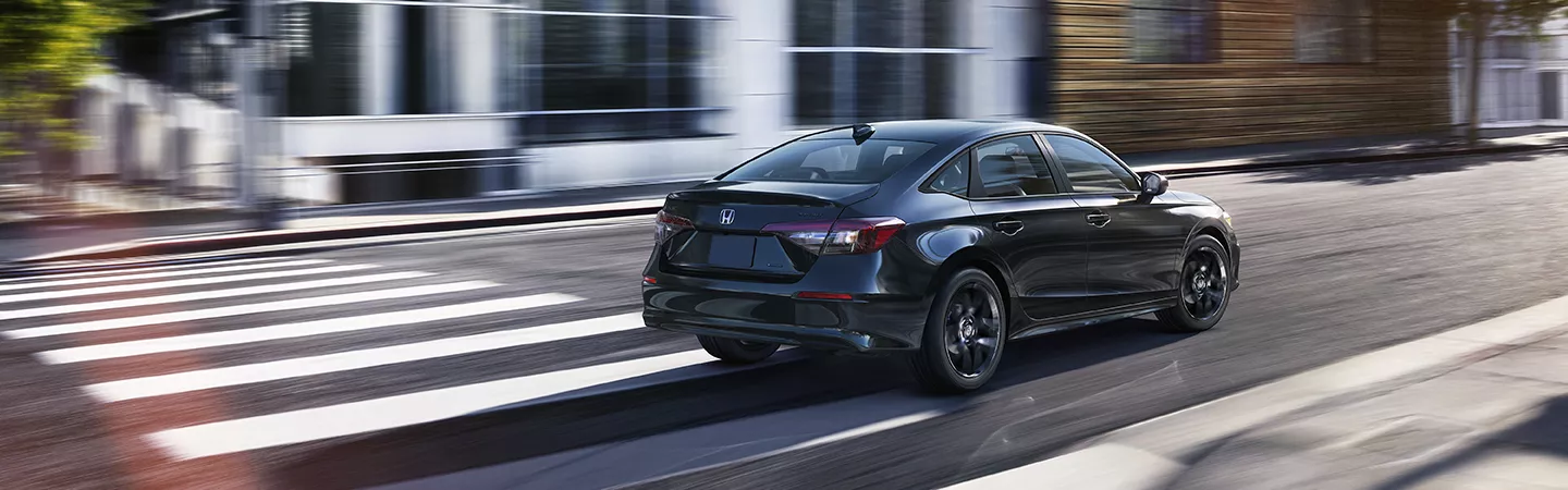 2026 Honda Civic driving in a city