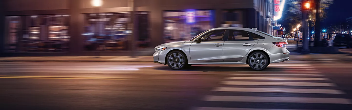 2026 Honda Civic driving in a city