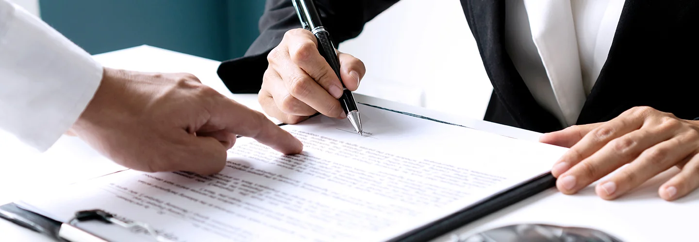 Customer signing papers