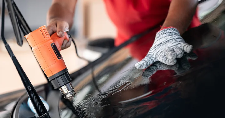 auto mechanic working on brakes