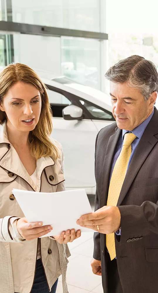 Finance manager going over a contract with a woman