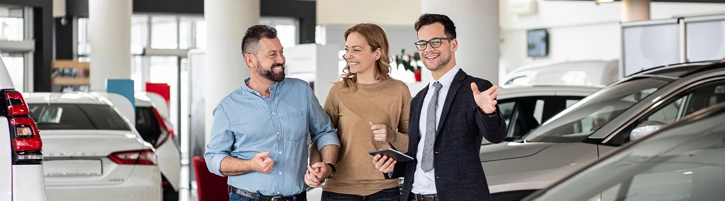 Sales person talking to customers about lease options