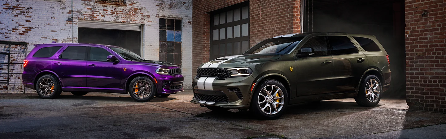 Two parked 2026 Dodge Durango in a bakc ally shop