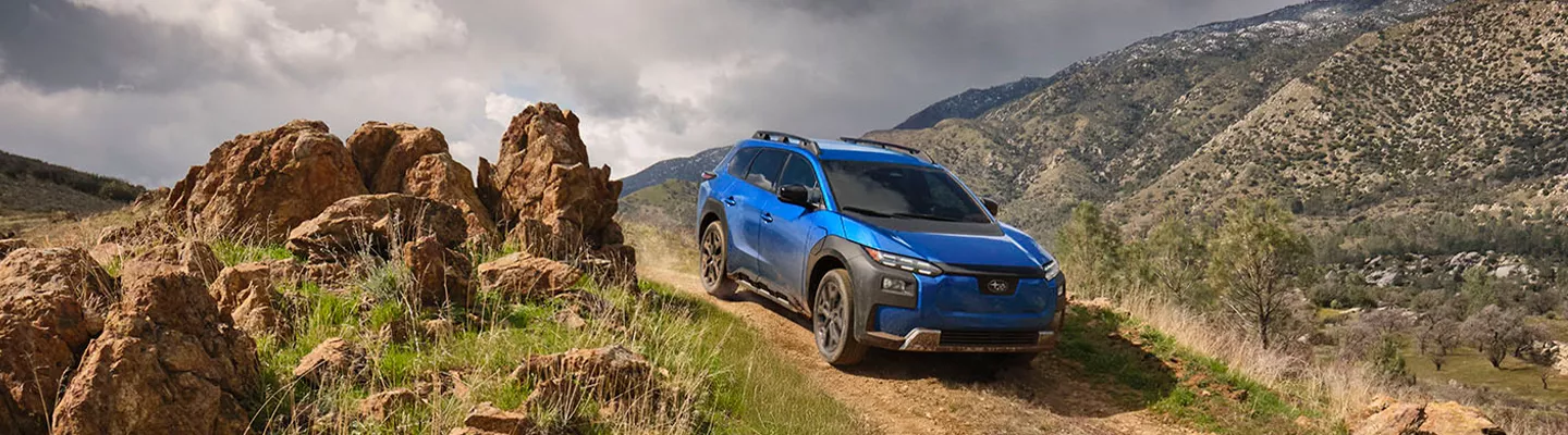 Subaru Trailseeker driving down a mountain road