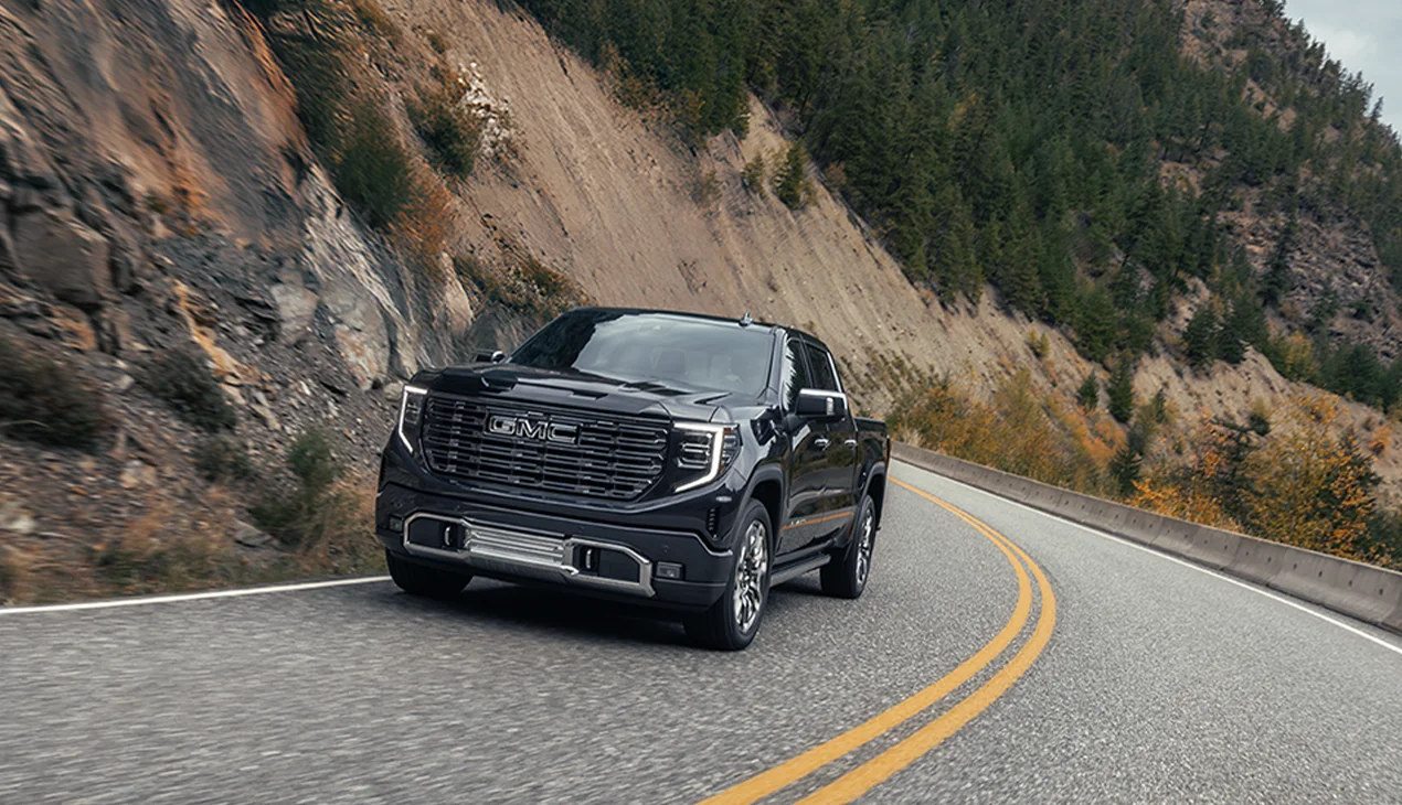 GMC truck on curvy road
