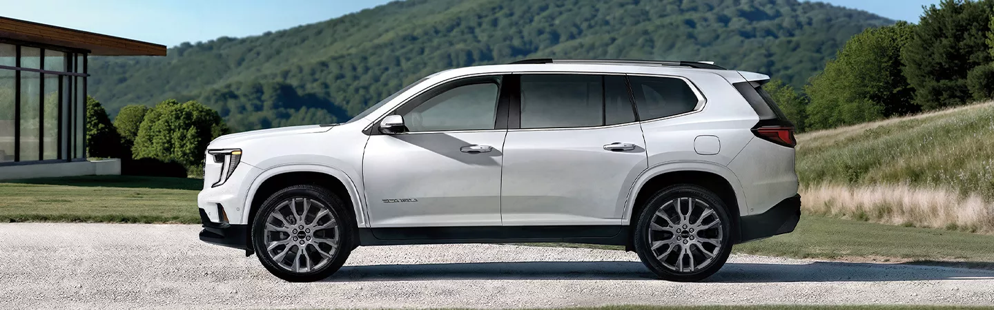 2026 GMC Acadia parked with mountains in the background