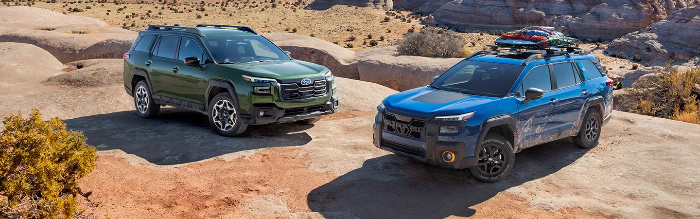 Two 2026 Subaru Outback Wilderness parked nect to each other on a rocky clearing