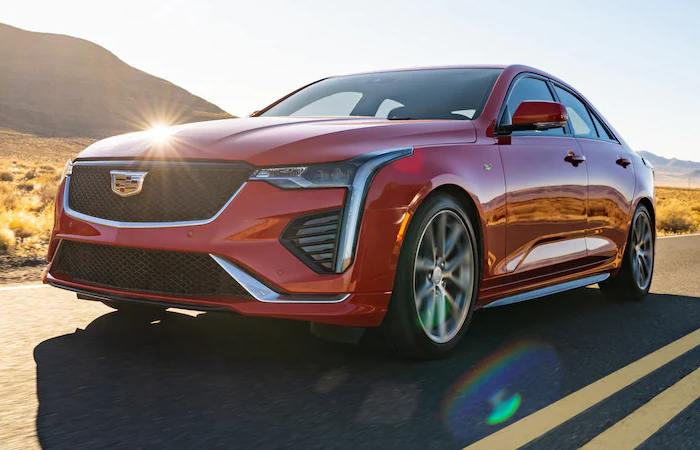 Full front view of the red CT4 in motion 