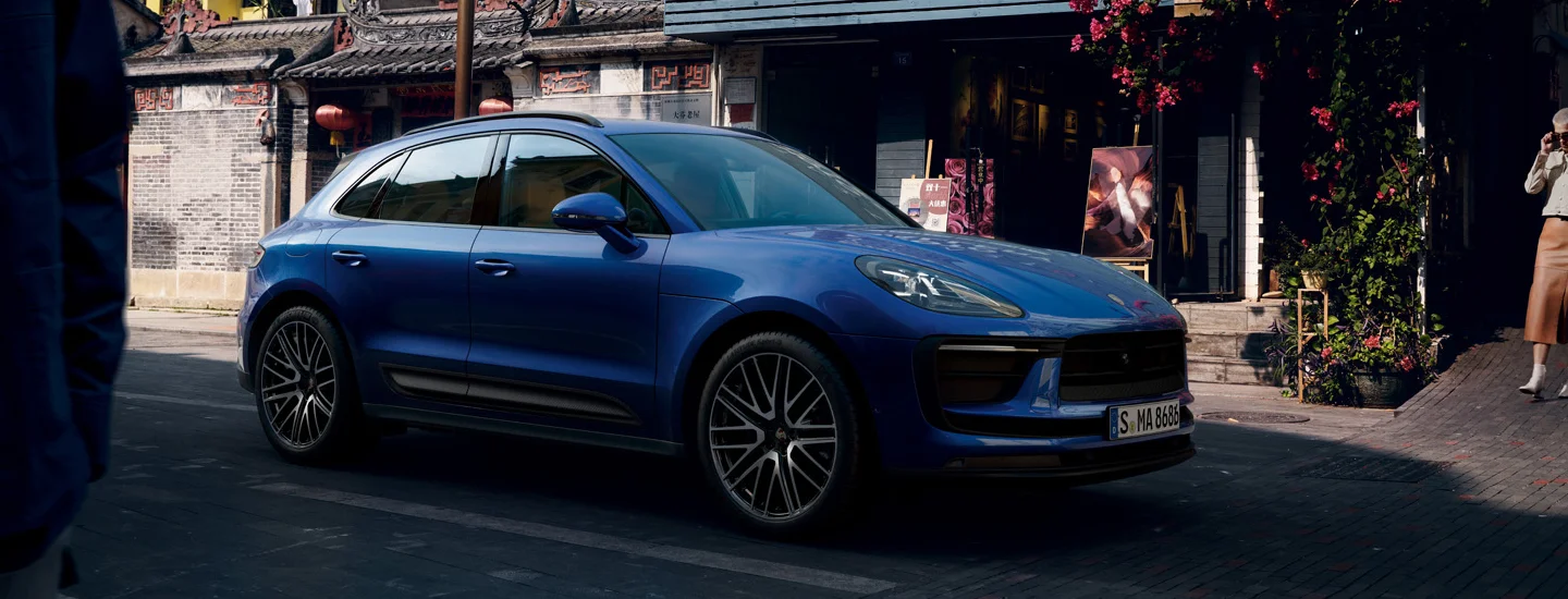 blue 2025 Porsche Macan parked in Italy