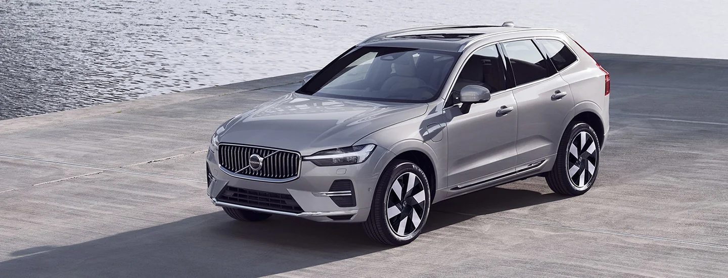 a gray 2025 Volvo XC60 parked by water