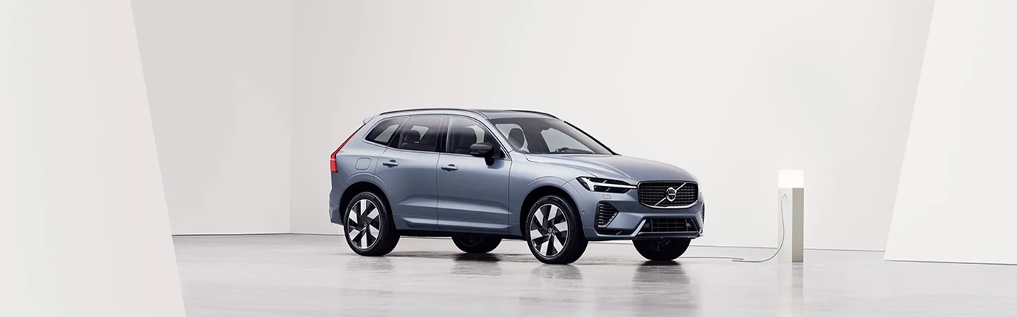 Blue parked 2025 Volvo XC60 at a charging station