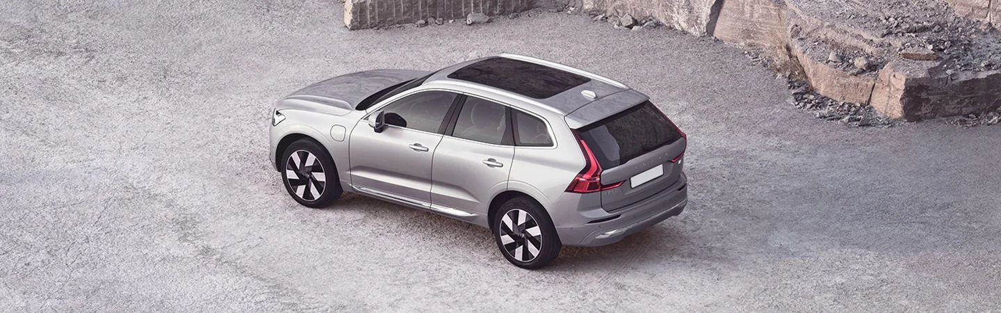 top side view of a parked gray 2025 Volvo XC60 on gravel