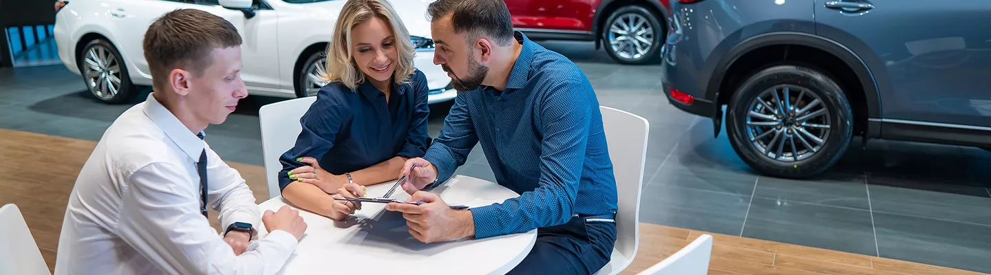 Customers sitting with a salesperson at Ford of Port Richey