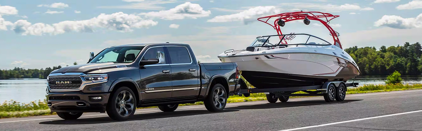 2024 RAM 1500 vs Chevrolet Silverado black color side view