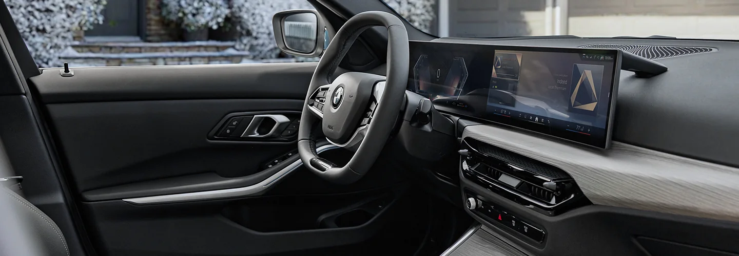 Interior view of the front seat and dashboard board of a 2026 BMW 3 Series