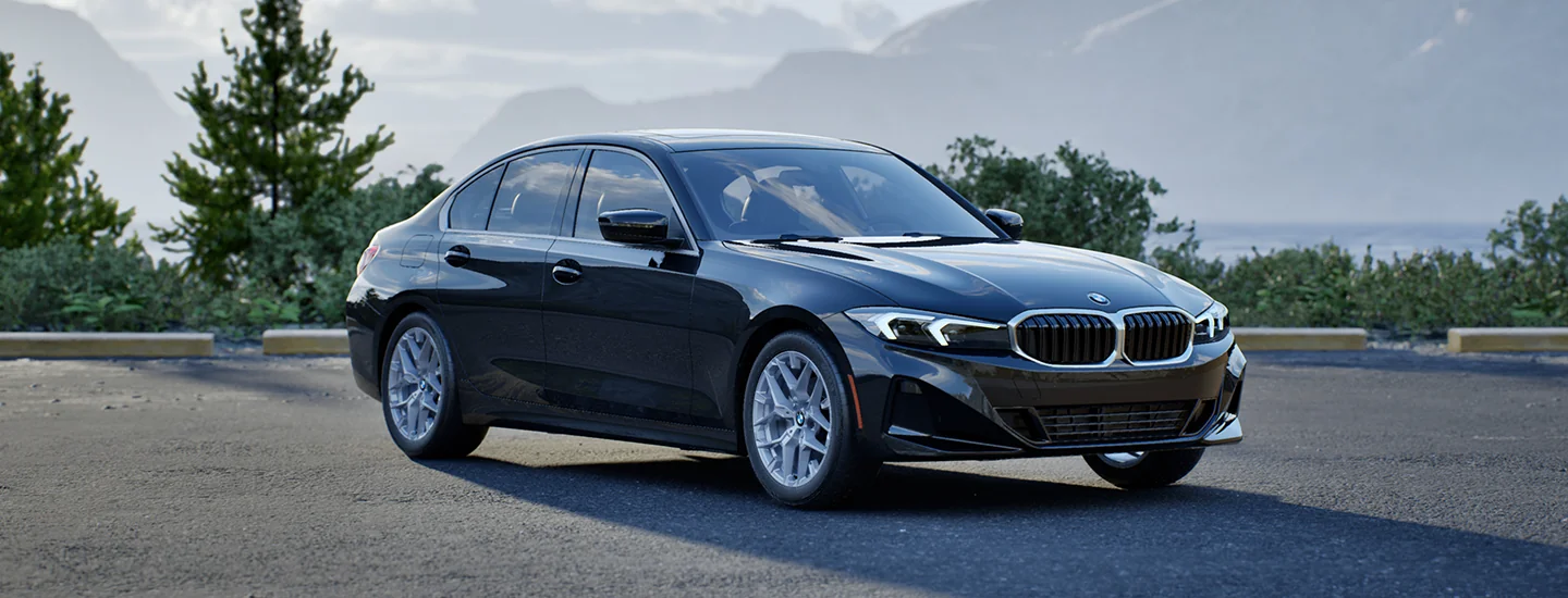 Side view of a black 2026 BMW 3 Series parked in a parking lot