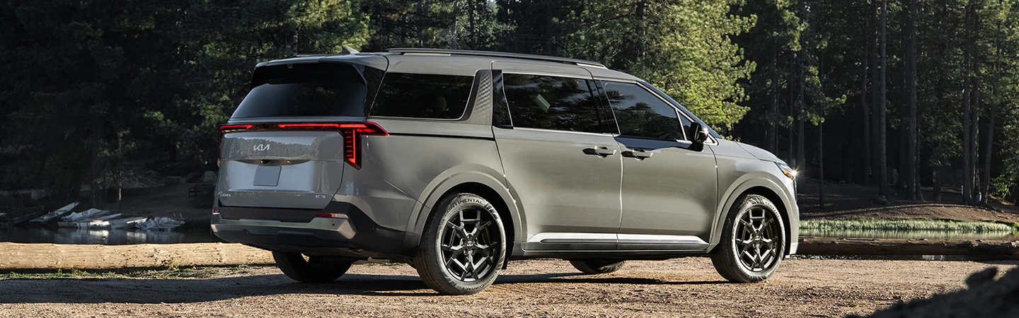 2026 Kia Carnival parked by a lake