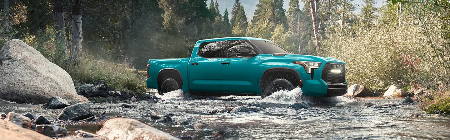 teal 2026 Toyota Tundra in river