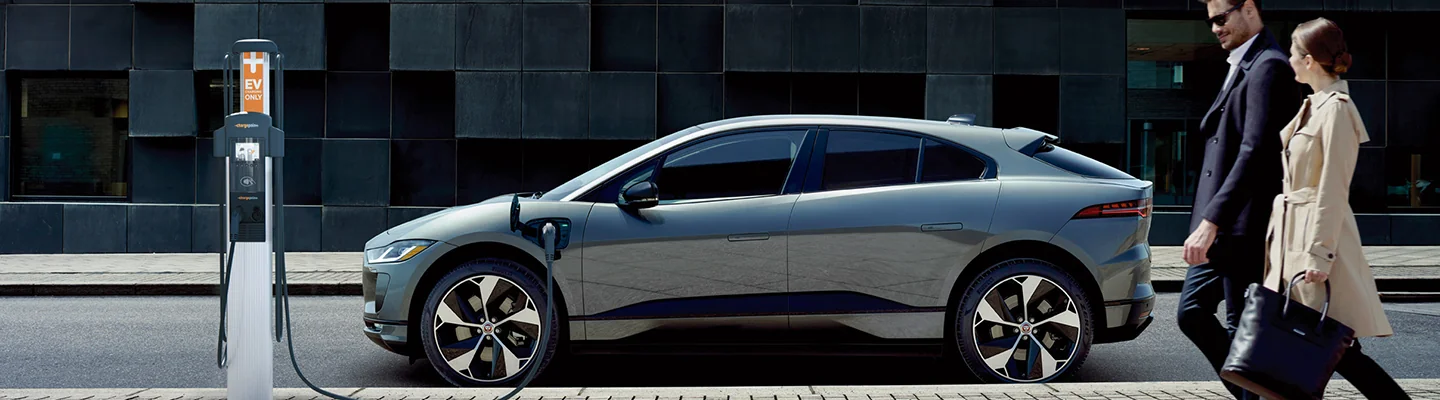 silver Jaguar I-PACE parked in cit