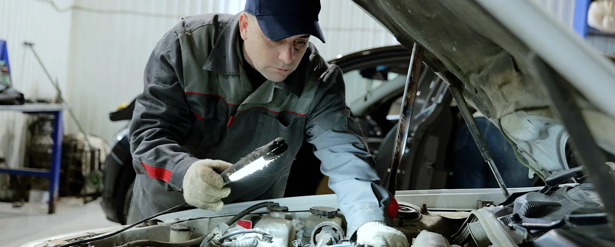 Service tech doing some engine work