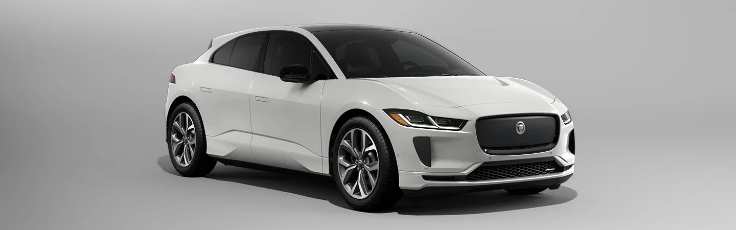 2024 Jaguar I-PACE vs Tesla Model X side front in white