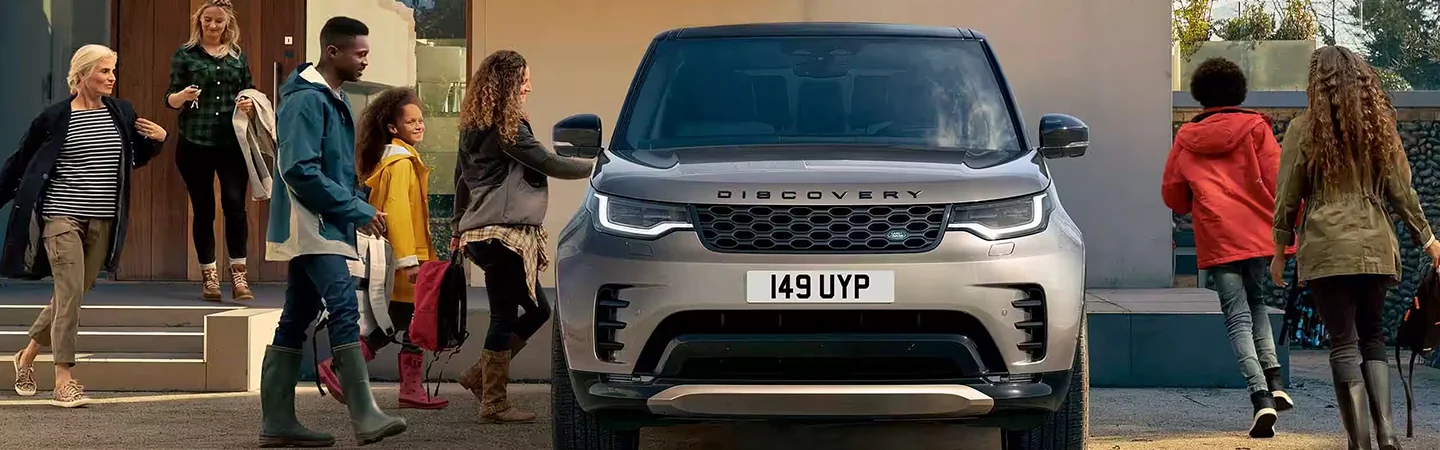 2024 Discovery vs Audi Q7 front side in brown