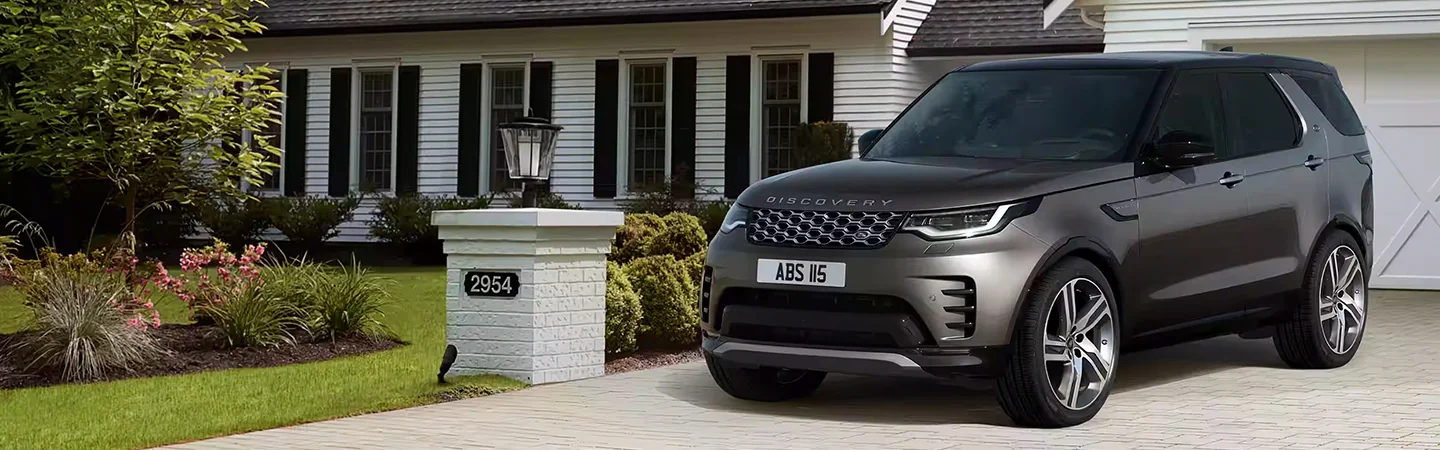 2024 Discovery vs Audi Q7 side front in silver