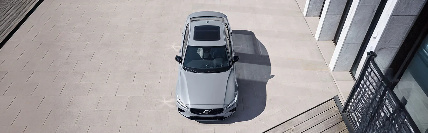 Top view of a parked 2025 Volvo S60 in front of a building