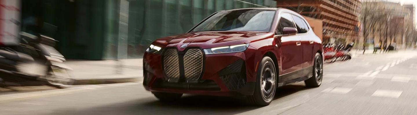 Electric BMW iX driving in the city