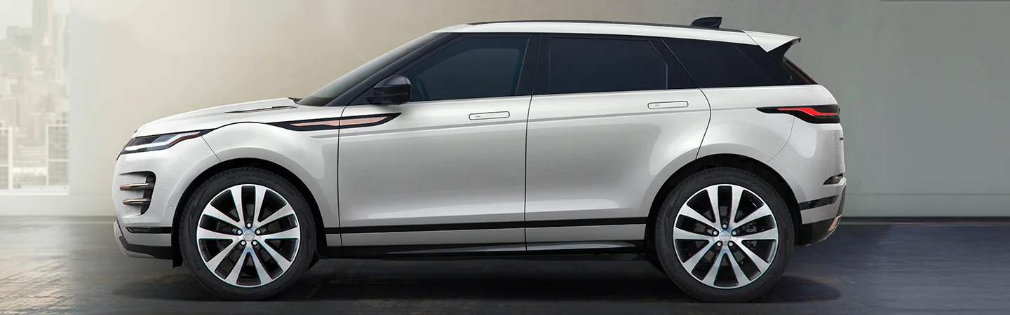 Side view of a white parked 2025 Range Rover Evoque