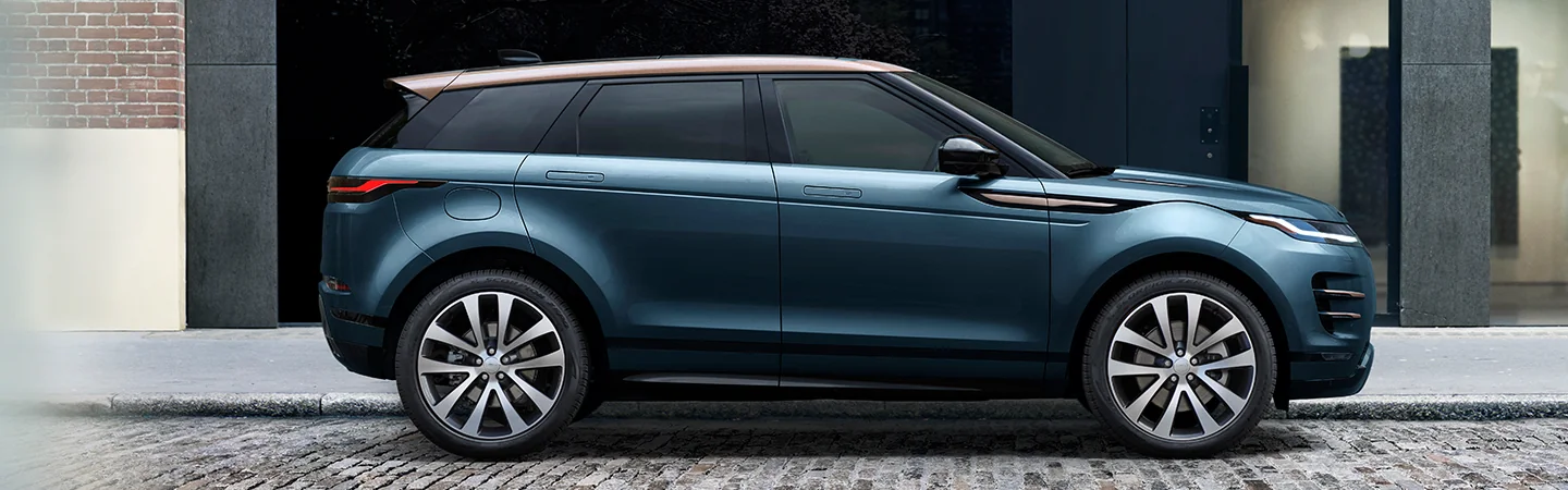 Side view of a parked 2025 Range Rover Evoque on a city street