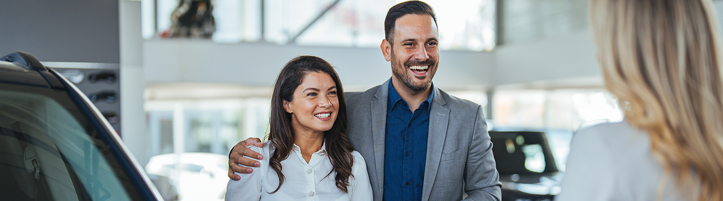 A happy couple looking to buy a Subaru Near The Villages