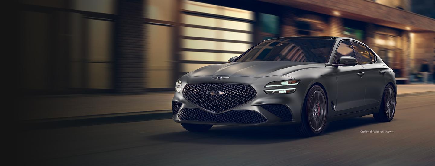 2022 Genesis G70 driving in city in motion