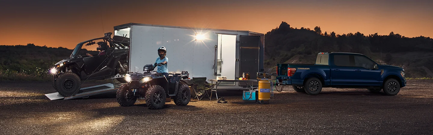 2025 Ford F-150 Blue color car with motorcycles