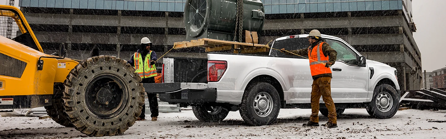 2025 Ford F-150 White color car with standing man