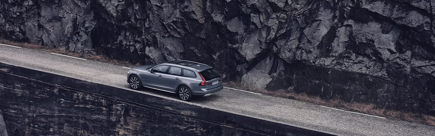 top view of a 2025 Volvo V90 Cross Country Plus on a cliff side road